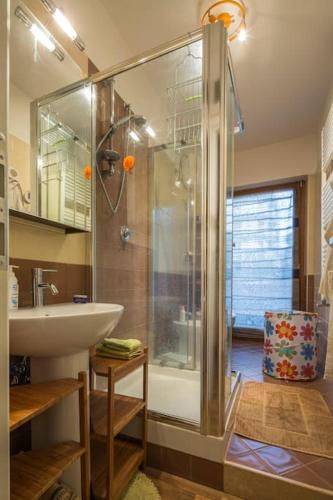 a bathroom with a shower and a sink at Sunny Open Space in Pompei