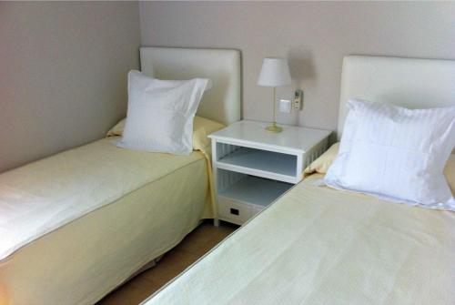 A bed or beds in a room at Par 4 Villa 7