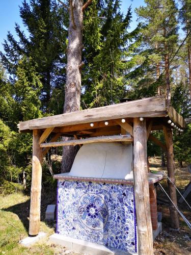 a wooden structure with a toilet in a tree at Metsaräägu Wellness in Ulendi