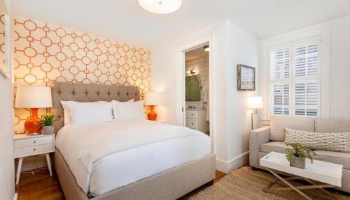 a white bedroom with a bed and a couch at Nantucket Resort Collection in Nantucket