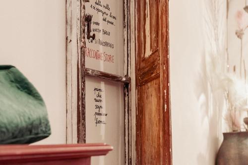 an old mirror with writing on a wall at LA TULIPA in San Quirico dʼOrcia