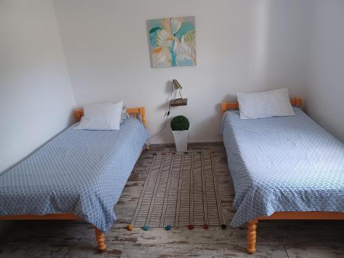 Łóżko lub łóżka w pokoju w obiekcie Quinta da Ponte das Hortas 3