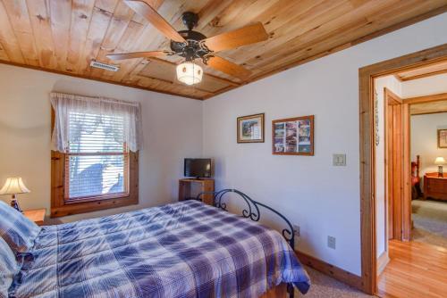 a bedroom with a bed and a ceiling fan at Fox's Lair in Sugar Grove