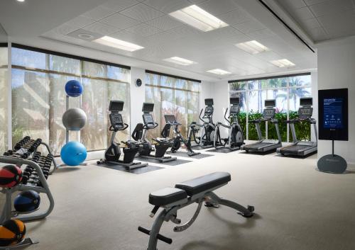 a gym with a lot of treadmills and exercise bikes at Courtyard by Marriott Faro Blanco Resort in Marathon