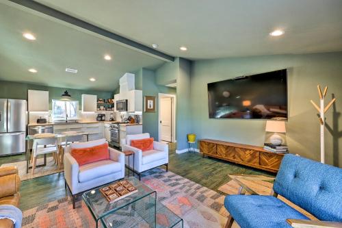 a living room with a couch and chairs and a kitchen at Modern Bentonville Home Mountain Bikers Paradise in Bentonville