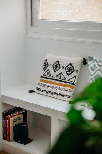 a pillow sitting on a shelf next to a window at tuGuest Carretera de la Sierra Apartment in Granada