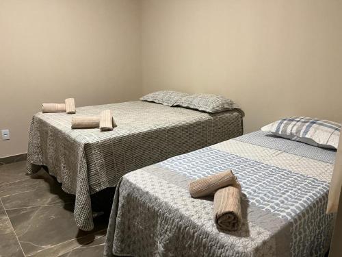 Un pat sau paturi într-o cameră la Dw suites Barra Grande Bahia