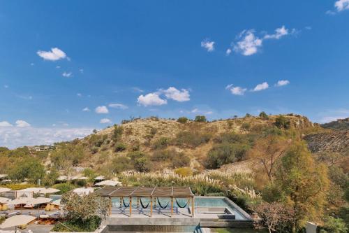 a resort with a mountain in the background at Live Aqua San Miguel de Allende in San Miguel de Allende