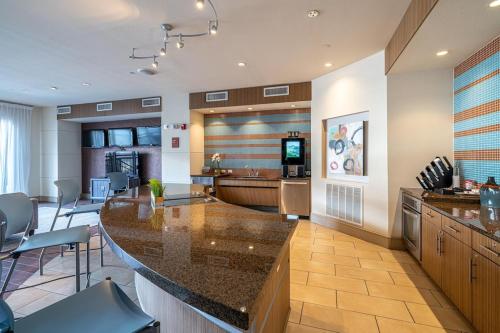 a kitchen with a large island in a room at A Touch of Class in Houston