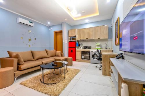 a living room with a couch and a table at Cecilia Homes in Lekki