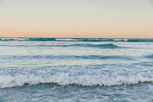 a view of the ocean with small waves at Bliss on the Bay in Struisbaai