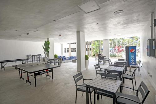 a dining room with tables and chairs and tablesktop at Ocean Reserve Condominium in Miami Beach
