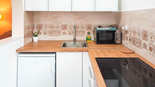 Η κουζίνα ή μικρή κουζίνα στο FilinHome Pelagica Suite