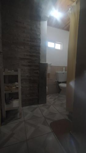 a bathroom with a sink and a toilet in a room at Casa Norte in Diamante