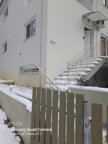 a group of stairs in a building with snow at Villa Eva I in Nédhousa