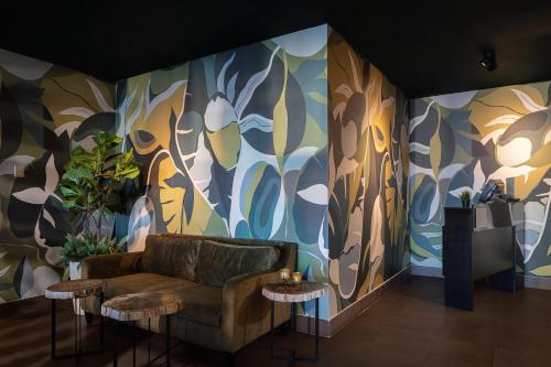 a living room with a couch and a colorful wall at Crowne Plaza Santo Domingo by IHG in Santo Domingo