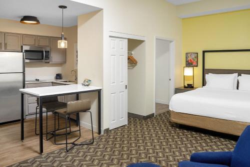 a hotel room with a bed and a kitchen at Residence Inn New Rochelle in New Rochelle