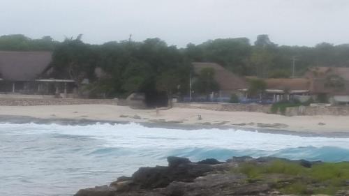 a view of a beach with the ocean at Sunset Coin Lembongan in Nusa Lembongan