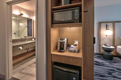 a bathroom with a sink and a microwave at Fairfield Inn & Suites by Marriott Albuquerque North in Albuquerque