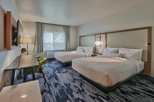 a hotel room with two beds and a window at Fairfield Inn & Suites by Marriott Albuquerque North in Albuquerque