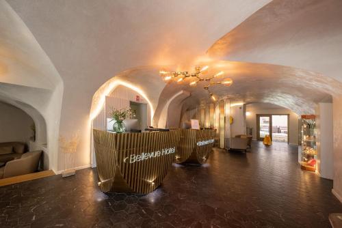 a hallway with a lobby with a chandelier at Bellevue Hotel Český Krumlov in Český Krumlov