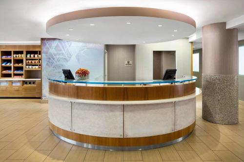 a lobby with a circular counter in a building at SpringHill Suites by Marriott Flagstaff in Flagstaff