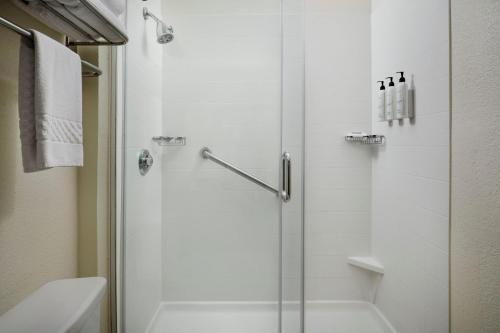 a shower with a glass door in a bathroom at SpringHill Suites Nashville MetroCenter in Nashville