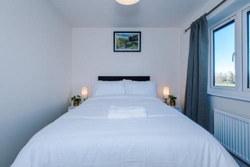 מיטה או מיטות בחדר ב-Videl Homes