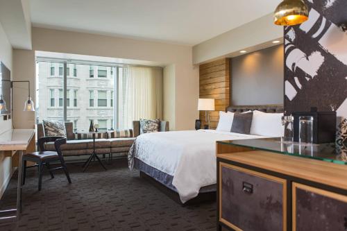 a hotel room with a large bed and a desk at Renaissance Allentown Hotel in Allentown