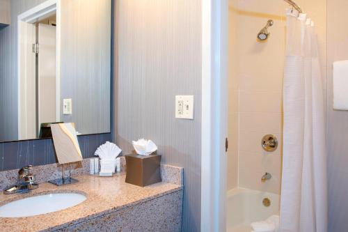 a bathroom with a sink and a shower at Courtyard Chicago Glenview/Northbrook in Glenview