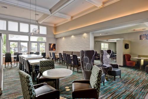 a dining room with tables and chairs and tablesktop at Residence Inn Los Angeles LAX/El Segundo in El Segundo