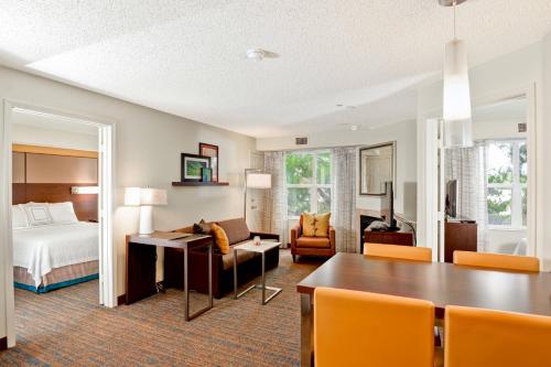 a hotel room with a bed and a dining room at Residence Inn Los Angeles LAX/El Segundo in El Segundo