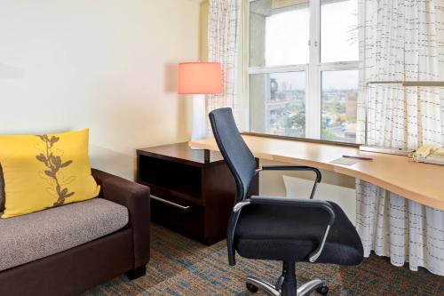a hotel room with a desk and a chair at Residence Inn Los Angeles LAX/El Segundo in El Segundo