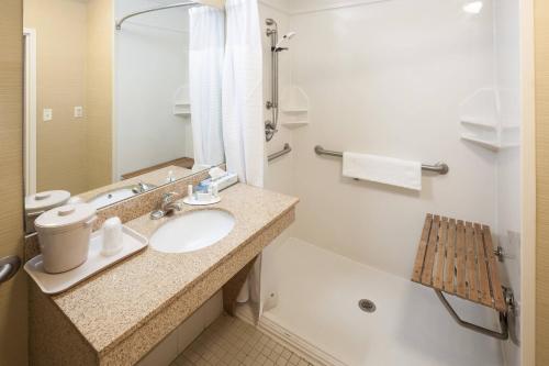 a bathroom with a sink and a toilet and a tub at Fairfield by Marriott Ruston in Ruston