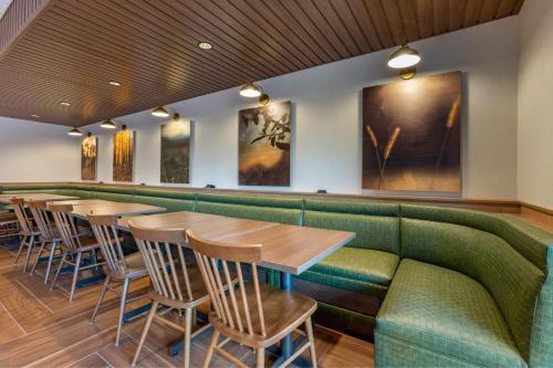 a row of tables and chairs in a restaurant at Fairfield by Marriott Inn & Suites Sandusky in Sandusky