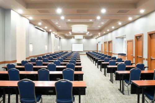 an empty lecture hall with desks and chairs at SpringHill Suites by Marriott Las Vegas Convention Center in Las Vegas