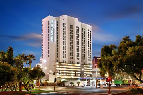 a tall white building on a city street at night at SpringHill Suites by Marriott Las Vegas Convention Center in Las Vegas