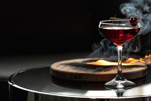 a drink in a glass sitting on a wooden coaster at AC Hotel by Marriott Miami Dadeland in Miami