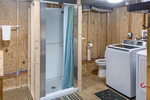 a bathroom with a shower and a washing machine at Ocean Mile L7 Gulf Beach Getaway in St. George Island