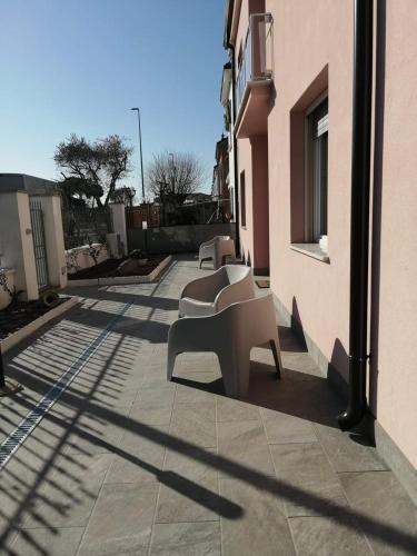 a bench sitting on the side of a building at MAWA in Ferrara