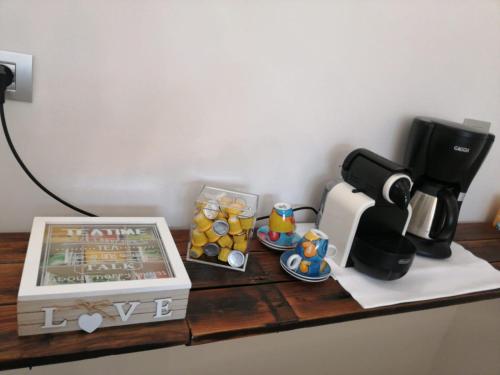 a counter top with a coffee maker and a coffee pot at MAWA in Ferrara