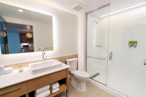 a bathroom with a toilet sink and a shower at Element Sacramento Airport in Sacramento