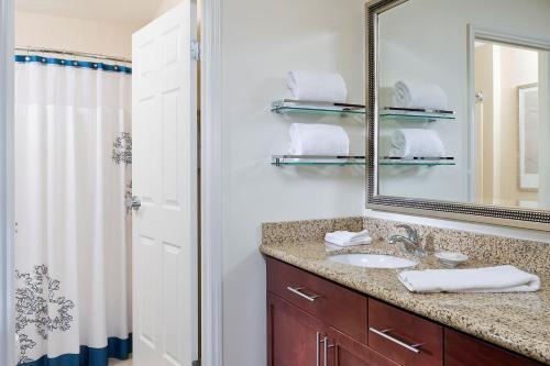 a bathroom with a sink and a mirror at Residence Inn Youngstown Boardman/Poland in Poland