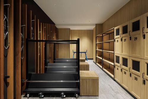a locker room with wooden walls and a staircase at Fairfield by Marriott Hyogo Kannabe Highland in Toyooka