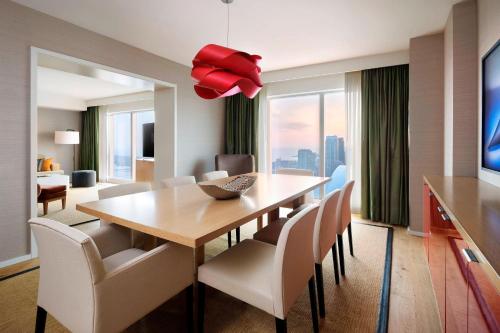 a dining room with a table and chairs at Delta Hotels by Marriott Toronto in Toronto
