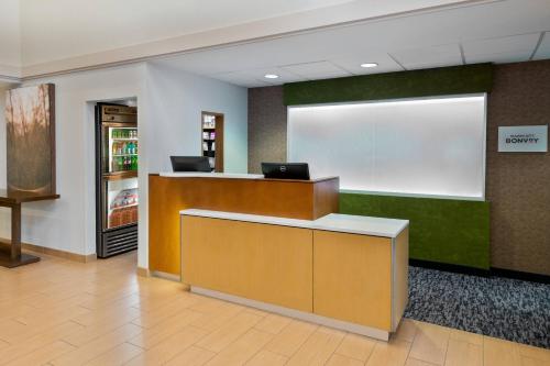 a lobby with a reception desk in a office at Fairfield Inn and Suites by Marriott Clearwater in Clearwater