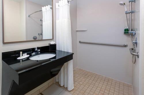 a bathroom with a sink and a shower at Fairfield Inn and Suites by Marriott Clearwater in Clearwater