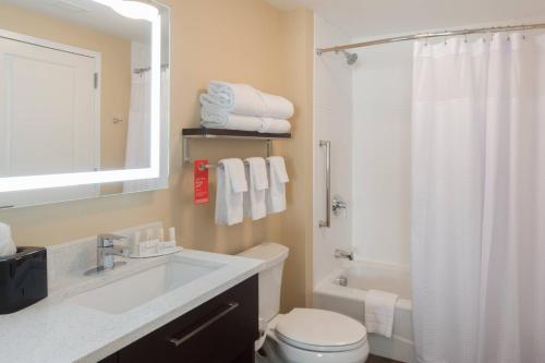 a bathroom with a sink and a toilet and a shower at TownePlace Suites by Marriott Syracuse Clay in Liverpool