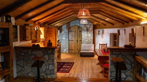 a large living room with a kitchen and a dining room at Old Wine House - Montenegro in Herceg-Novi