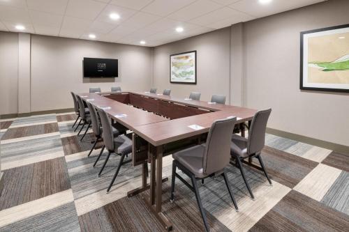 a conference room with a large table and chairs at Four Points by Sheraton Spartanburg in Spartanburg